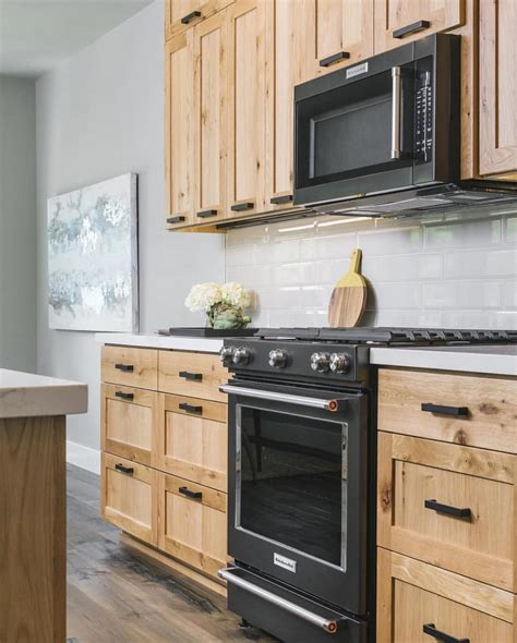 black stainless steel appliances with light wood cabinets|white kitchen black stainless appliances.